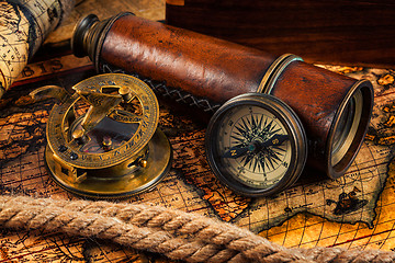 Image showing Old vintage compass and navigation instruments on ancient map