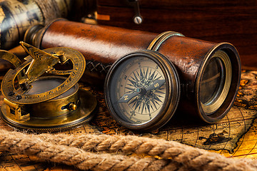 Image showing Old vintage compass and navigation instruments on ancient map