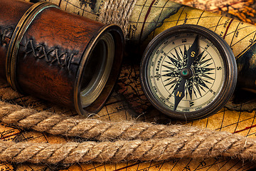 Image showing Old vintage compass and navigation instruments on ancient map