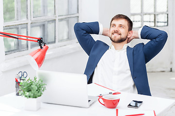 Image showing The male office worker resting