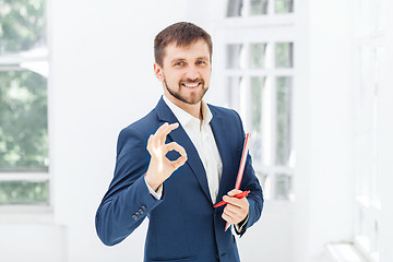 Image showing The smiling male office worker