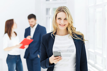 Image showing Portrait of businesswoman talking on phone in office