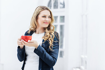 Image showing The female office worker having coffee break 