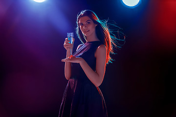 Image showing The beautiful girl dancing at the party drinking champagne