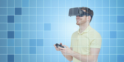 Image showing happy man in virtual reality headset with gamepad