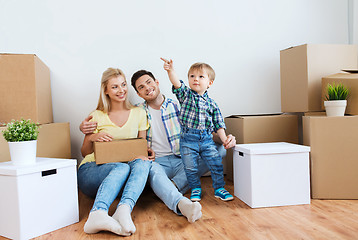 Image showing happy family with boxes moving to new home