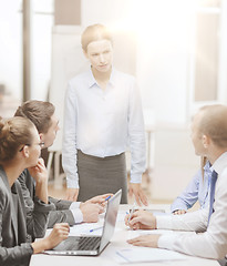 Image showing strict female boss talking to business team