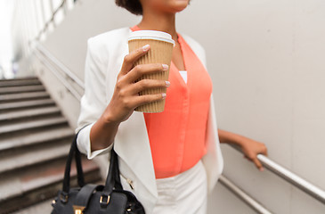 Image showing close up of african businesswoman with coffee