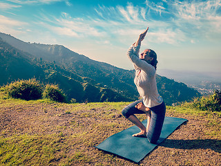 Image showing Young woman doing Ashtanga Vinyasa yoga advanced asana 