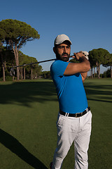 Image showing golf player hitting shot