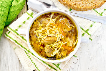 Image showing Soup with mushrooms and noodles in bowl on napkin top