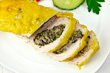 Image showing Roll chicken with mushrooms and cucumber on board top