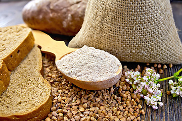 Image showing Flour buckwheat in spoon with cereals and bread on board