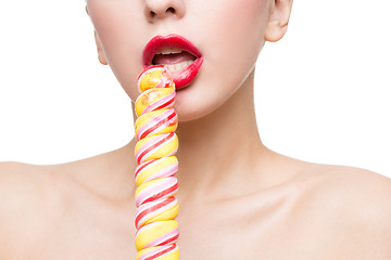 Image showing Close-up shot of woman\'s mouth bright red lips with lollipop. blowjob simulation