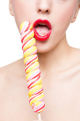 Image showing Close-up shot of woman\'s mouth bright red lips with lollipop. blowjob simulation