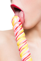 Image showing Close-up shot of woman\'s mouth bright red lips with lollipop. blowjob simulation