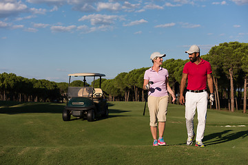 Image showing couple walking on golf course