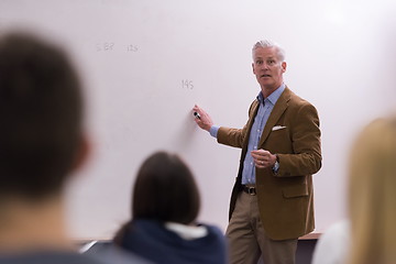 Image showing teacher with a group of hi school students in classroom