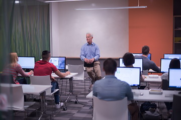 Image showing teacher and students in computer lab classroom