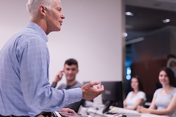 Image showing teacher and students in computer lab classroom