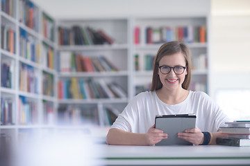 Image showing student with tablet in library