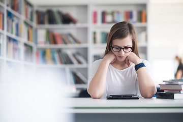 Image showing student with tablet in library