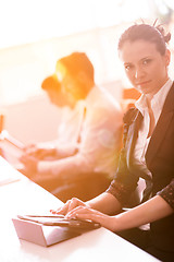 Image showing business woman at  office people group on meeting  in background