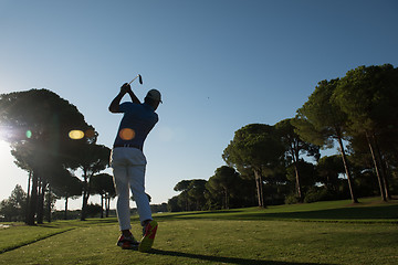 Image showing golf player hitting shot