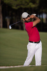 Image showing golfer hitting a sand bunker shot