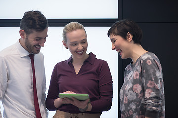 Image showing young business people group working on tablet