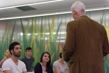 Image showing teacher with a group of students in classroom