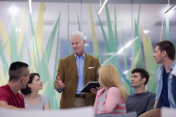 Image showing teacher with a group of students in classroom