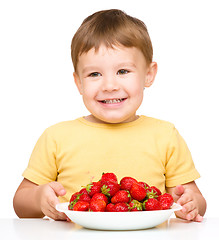 Image showing Little boy with strawberries