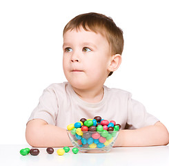 Image showing Portrait of a boy with candies