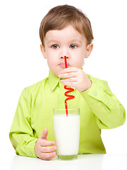 Image showing Cute little boy with a glass of milk