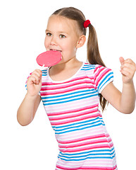 Image showing Little girl with lollipop