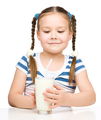 Image showing Cute little girl with a glass of milk