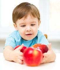 Image showing Portrait of a happy little boy with apples