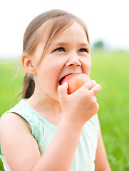 Image showing Portrait of a little girl with apple