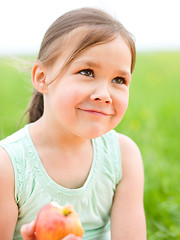 Image showing Portrait of a little girl with apple