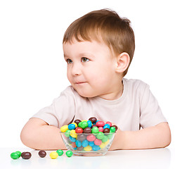 Image showing Portrait of a boy with candies