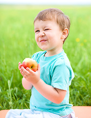 Image showing Portrait of a happy little boy with apple