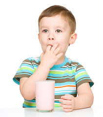 Image showing Cute little boy with a glass of milk