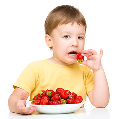 Image showing Little boy with strawberries