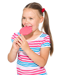 Image showing Little girl with lollipop