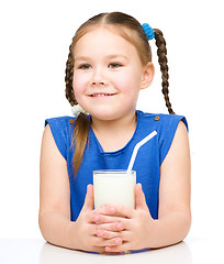 Image showing Cute little girl with a glass of milk