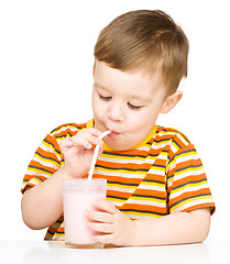 Image showing Cute little boy with a glass of milk