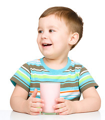 Image showing Cute little boy with a glass of milk