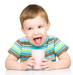 Image showing Cute little boy with a glass of milk