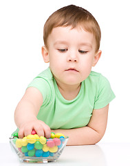 Image showing Portrait of a boy with candies